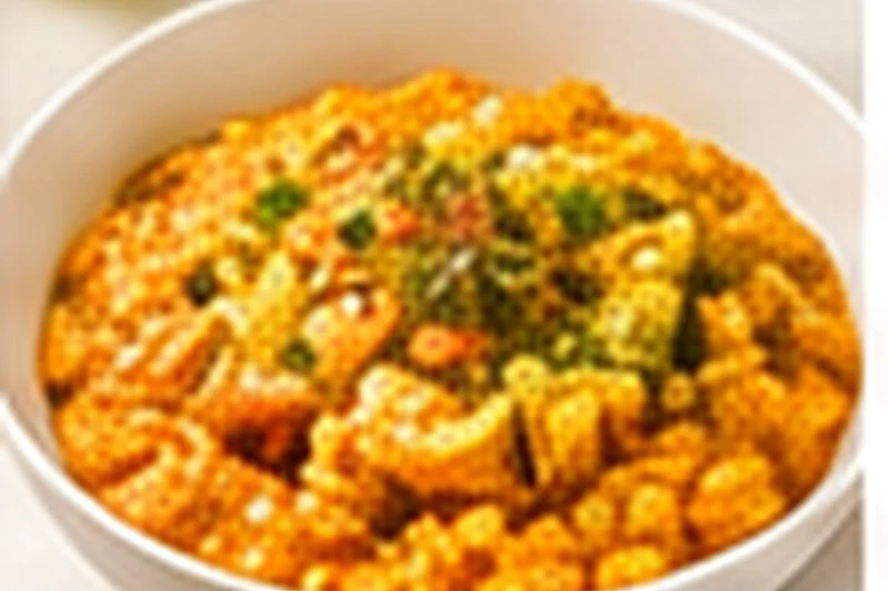 A plate of creamy orange pumpkin risotto sprinkled with chopped parsley.